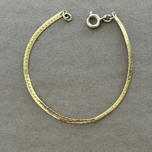 Gold baby bracelet.